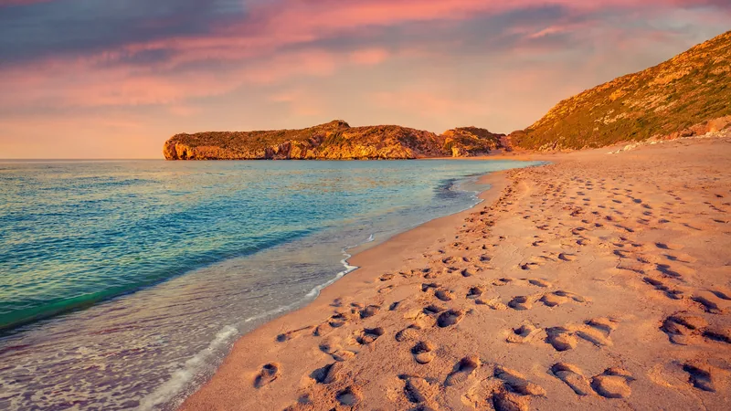 Footprints across the empty dunes of Patara beach